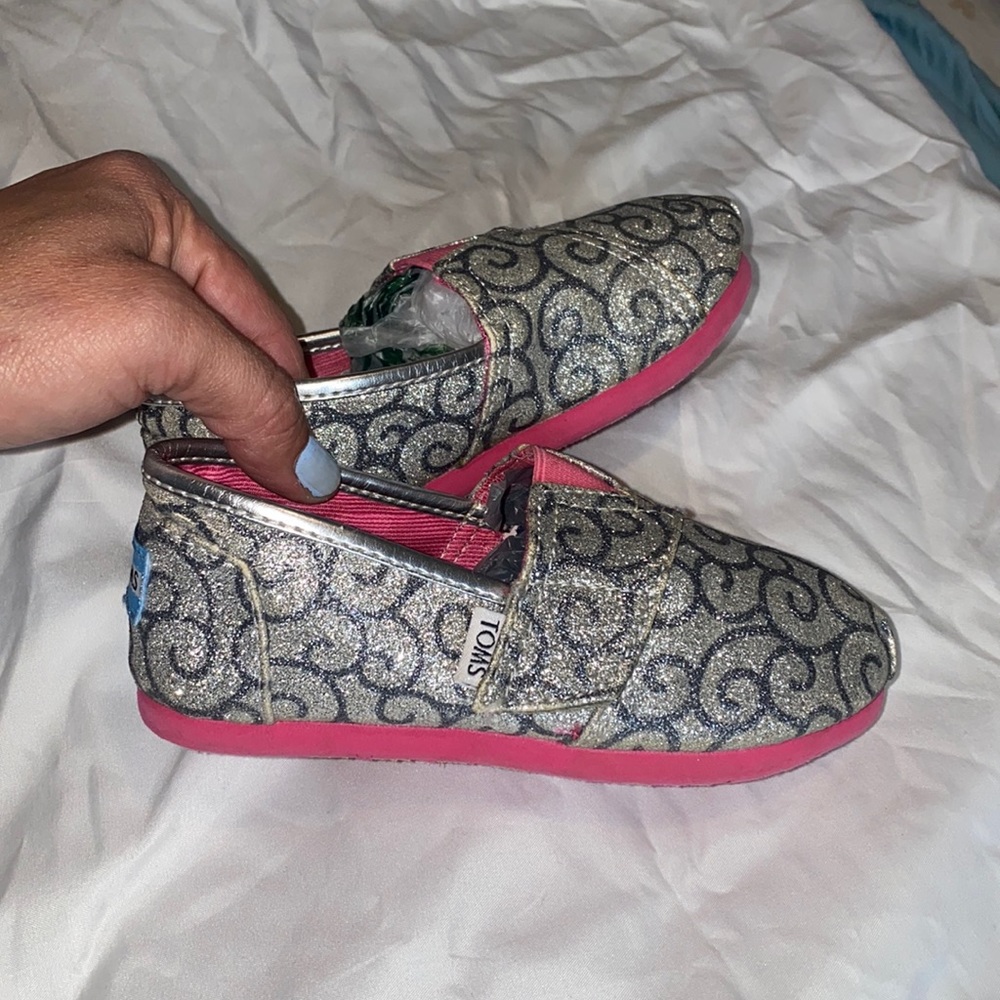 Toms kids slip one